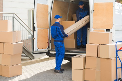 Stacked moving boxes and packing supplies in Queenspark