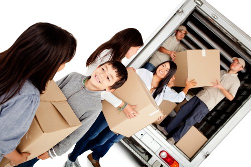 Moving van loading service with boxes and furniture