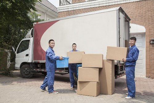Man and van loading boxes and furniture for a Queenspark local move