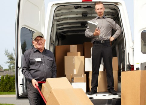 Man with van in Queenspark loading furniture for a local move