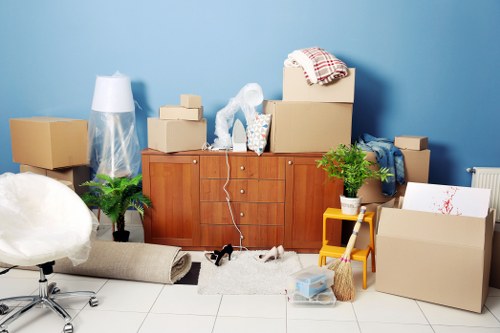 Moving boxes and furniture prepared for a home move in Queenspark