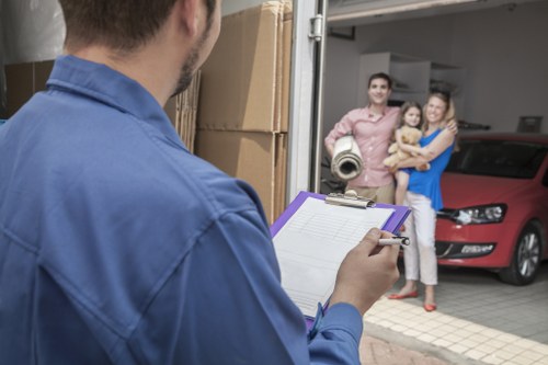 Packing boxes and protected furniture for flat removals in Queenspark