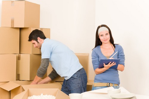 Packed moving boxes and furniture ready for same day removals in Queenspark
