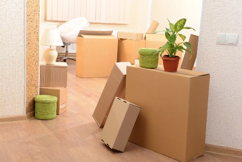 Packed boxes and furniture ready for a Queens Park home removal