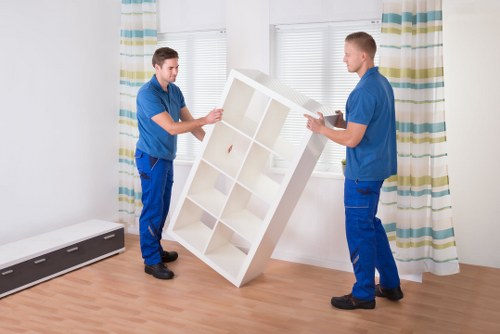 Staff preparing desks and equipment for office removals in Queenspark