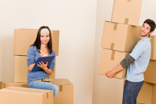 Professional moving support handling furniture during a home relocation