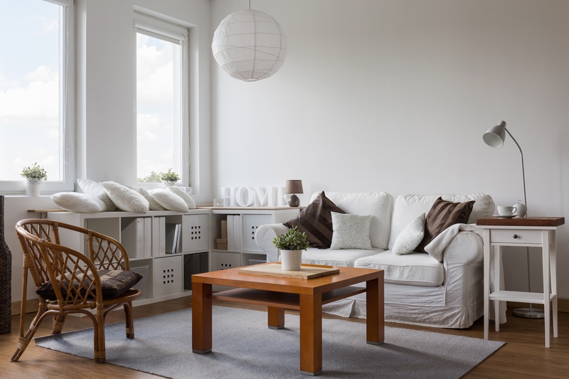 Local movers handling furniture in a Queens Park street